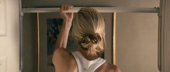 Movie still from “The Boys” (2019), created by Eric Kripke – A person holding a bar in a room; Close Up shot, Over the shoulder angle