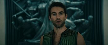 Movie still from “The Boys” (2019), created by Eric Kripke – A person wearing a vest and looking at the camera; Close Up shot, Over the shoulder angle