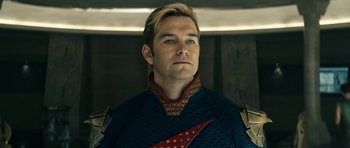 Movie still from “The Boys” (2019), created by Eric Kripke – A person wearing a costume; Close Up shot, Over the shoulder angle