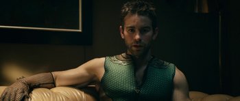 Movie still from “The Boys” (2019), created by Eric Kripke – A person sitting on a couch; Close Up shot, Over the shoulder angle