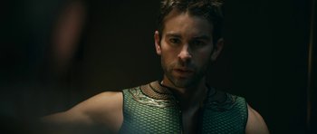 Movie still from “The Boys” (2019), created by Eric Kripke – A person wearing a green vest; Close Up shot, High angle
