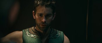 Movie still from “The Boys” (2019), created by Eric Kripke – A person wearing a vest; Close Up shot, High angle