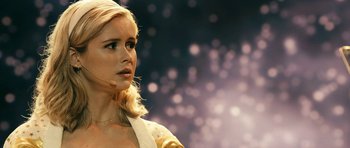 Movie still from “The Boys” (2019), created by Eric Kripke – A beautiful young blonde woman looking to her left; Close Up shot, Over the shoulder angle