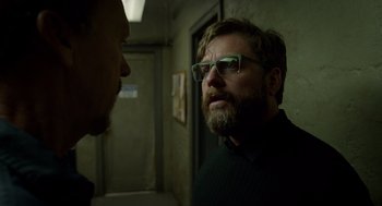 Movie still from “Birdman or (The Unexpected Virtue of Ignorance)” (2014), directed by Alejandro G. Iñárritu – A man with a goatee and glasses talking to another man; Close Up shot, Over the shoulder angle