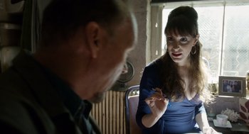 Movie still from “Birdman or (The Unexpected Virtue of Ignorance)” (2014), directed by Alejandro G. Iñárritu – A man and a woman sitting at a table talking to each other; Medium shot, Over the shoulder angle