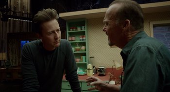 Movie still from “Birdman or (The Unexpected Virtue of Ignorance)” (2014), directed by Alejandro G. Iñárritu – Two men are talking in a kitchen; Medium shot, Over the shoulder angle