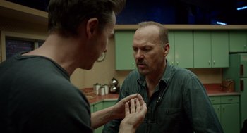 Movie still from “Birdman or (The Unexpected Virtue of Ignorance)” (2014), directed by Alejandro G. Iñárritu – A man looking at another man in a kitchen; Close Up shot, Over the shoulder angle