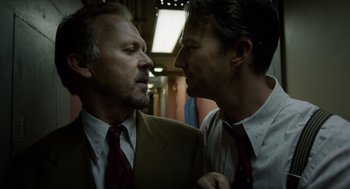 Movie still from “Birdman or (The Unexpected Virtue of Ignorance)” (2014), directed by Alejandro G. Iñárritu – A couple of men standing next to each other; Close Up shot, Over the shoulder angle
