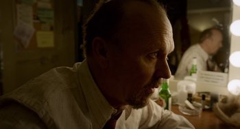 Movie still from “Birdman or (The Unexpected Virtue of Ignorance)” (2014), directed by Alejandro G. Iñárritu – A person wearing a shirt and tie; Close Up shot, Low angle