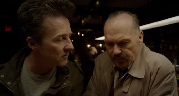Movie still from “Birdman or (The Unexpected Virtue of Ignorance)” (2014), directed by Alejandro G. Iñárritu – Two men are talking to each other in a room; Close Up shot, Over the shoulder angle