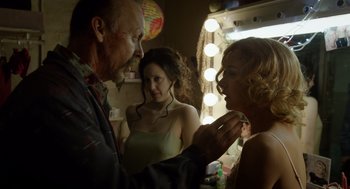 Movie still from “Birdman or (The Unexpected Virtue of Ignorance)” (2014), directed by Alejandro G. Iñárritu – A man and two women in front of a mirror; Medium shot, Over the shoulder angle