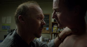 Movie still from “Birdman or (The Unexpected Virtue of Ignorance)” (2014), directed by Alejandro G. Iñárritu – Two men touching each other's faces in a room; Close Up shot, Over the shoulder angle