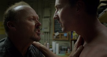 Movie still from “Birdman or (The Unexpected Virtue of Ignorance)” (2014), directed by Alejandro G. Iñárritu – Two men face each other in a room; Close Up shot, Over the shoulder angle