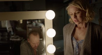 Movie still from “Birdman or (The Unexpected Virtue of Ignorance)” (2014), directed by Alejandro G. Iñárritu – A man and a woman in front of a vanity mirror; Medium shot, Over the shoulder angle