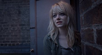Movie still from “Birdman or (The Unexpected Virtue of Ignorance)” (2014), directed by Alejandro G. Iñárritu – A woman with long blonde hair wearing a green shirt; Close Up shot, Over the shoulder angle
