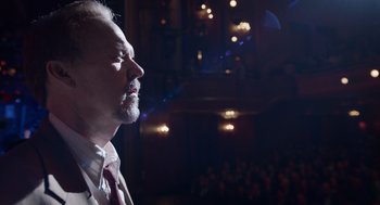 Movie still from “Birdman or (The Unexpected Virtue of Ignorance)” (2014), directed by Alejandro G. Iñárritu – A man with a goatee is looking up at the ceiling; Close Up shot, Low angle
