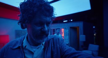 Movie still from “Birdman or (The Unexpected Virtue of Ignorance)” (2014), directed by Alejandro G. Iñárritu – A person wearing a jacket; Close Up shot, Low angle