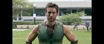 Movie still from “The Boys” (2019), created by Eric Kripke – A person wearing a body suit; Medium shot, Over the shoulder angle