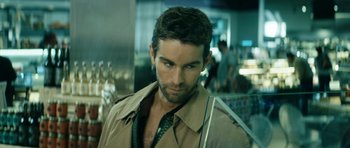 Movie still from “The Boys” (2019), created by Eric Kripke – A person wearing a trench coat; Close Up shot, Over the shoulder angle