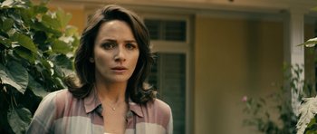 Movie still from “The Boys” (2019), created by Eric Kripke – A person wearing a striped shirt; Close Up shot, Over the shoulder angle