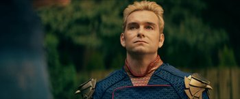 Movie still from “The Boys” (2019), created by Eric Kripke – A person wearing a costume; Close Up shot, Over the shoulder angle