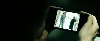 Movie still from “The Boys” (2019), created by Eric Kripke – A person taking a picture with a cell phone; Extreme Close Up shot, Overhead angle