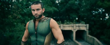 Movie still from “The Boys” (2019), created by Eric Kripke – A person wearing a body suit; Medium shot, Over the shoulder angle