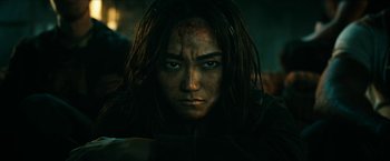 Movie still from “The Boys” (2019), created by Eric Kripke – A person with long black hair; Close Up shot, Low angle