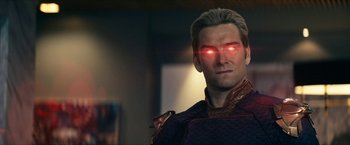 Movie still from “The Boys” (2019), created by Eric Kripke – A person with a red eye; Close Up shot, Over the shoulder angle