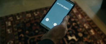 Movie still from “The Boys” (2019), created by Eric Kripke – A person is holding a cell phone in their hand; Extreme Close Up shot, High angle