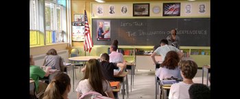 Movie still from “The Boys” (2019), created by Eric Kripke – A class room filled with students in front of a chalkboard; Wide shot, Low angle