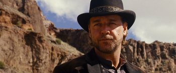 Movie still from “3:10 to Yuma” (2007), directed by James Mangold – A person wearing a hat; Close Up shot, Low angle