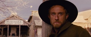Movie still from “3:10 to Yuma” (2007), directed by James Mangold – A person wearing a hat; Close Up shot, Low angle