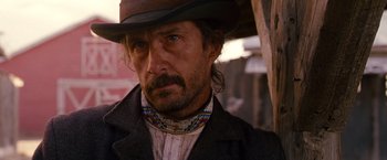 Movie still from “3:10 to Yuma” (2007), directed by James Mangold – A person wearing a hat; Close Up shot, Over the shoulder angle