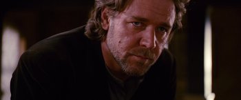 Movie still from “3:10 to Yuma” (2007), directed by James Mangold – A person with long hair and a beard; Close Up shot, Over the shoulder angle