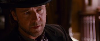 Movie still from “3:10 to Yuma” (2007), directed by James Mangold – A person wearing a hat; Close Up shot, Over the shoulder angle