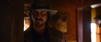 Movie still from “3:10 to Yuma” (2007), directed by James Mangold – A person wearing a hat; Close Up shot, Low angle