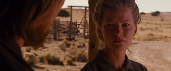 Movie still from “3:10 to Yuma” (2007), directed by James Mangold – A person with a fence in the background; Close Up shot, Over the shoulder angle