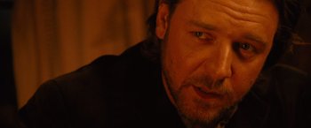 Movie still from “3:10 to Yuma” (2007), directed by James Mangold – A man's face in the dark; Close Up shot, Over the shoulder angle
