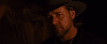 Movie still from “3:10 to Yuma” (2007), directed by James Mangold – A person wearing a cowboy hat; Close Up shot, Over the shoulder angle