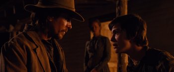 Movie still from “3:10 to Yuma” (2007), directed by James Mangold – A man and a woman are talking to each other; Medium shot, Over the shoulder angle
