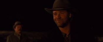 Movie still from “3:10 to Yuma” (2007), directed by James Mangold – A person wearing a hat; Close Up shot, Over the shoulder angle