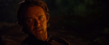 Movie still from “3:10 to Yuma” (2007), directed by James Mangold – A person wearing a jacket; Close Up shot, Over the shoulder angle