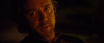 Movie still from “3:10 to Yuma” (2007), directed by James Mangold – A man's face in the dark; Close Up shot, Over the shoulder angle