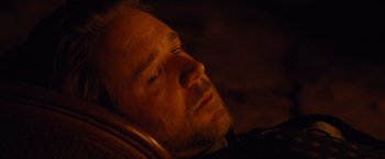 Movie still from “3:10 to Yuma” (2007), directed by James Mangold – A person laying on a bed; Close Up shot, High angle