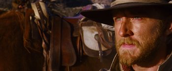 Movie still from “3:10 to Yuma” (2007), directed by James Mangold – A person wearing a cowboy hat; Close Up shot, Low angle
