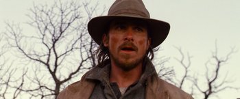 Movie still from “3:10 to Yuma” (2007), directed by James Mangold – A person wearing a hat; Close Up shot, Over the shoulder angle