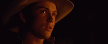 Movie still from “3:10 to Yuma” (2007), directed by James Mangold – A person wearing a cowboy hat; Close Up shot, Over the shoulder angle