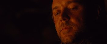 Movie still from “3:10 to Yuma” (2007), directed by James Mangold – A person with his eyes closed; Close Up shot, Over the shoulder angle