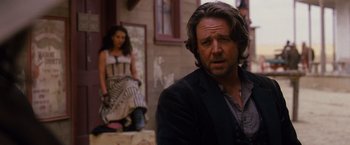 Movie still from “3:10 to Yuma” (2007), directed by James Mangold – A man and a woman are sitting on steps; Close Up shot, Over the shoulder angle